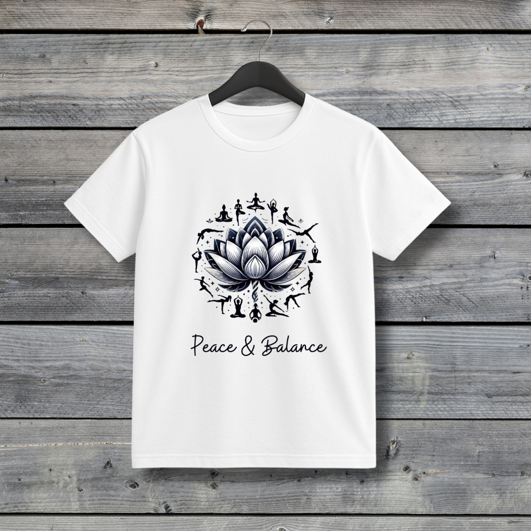 White t-shirt with a black lotus design and 'Peace & Balance' text on a wooden background