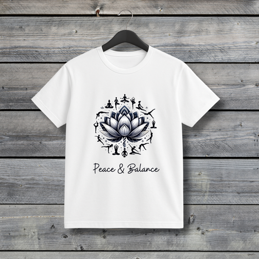 White t-shirt with a black lotus design and 'Peace & Balance' text on a wooden background
