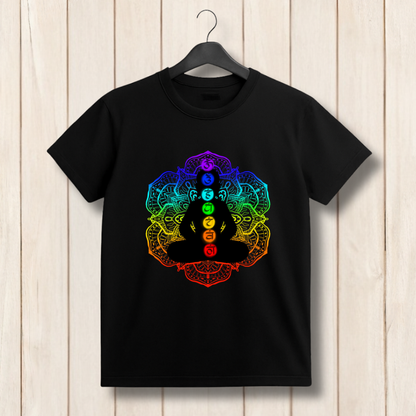 Black t-shirt with a colorful chakra design on a wooden background