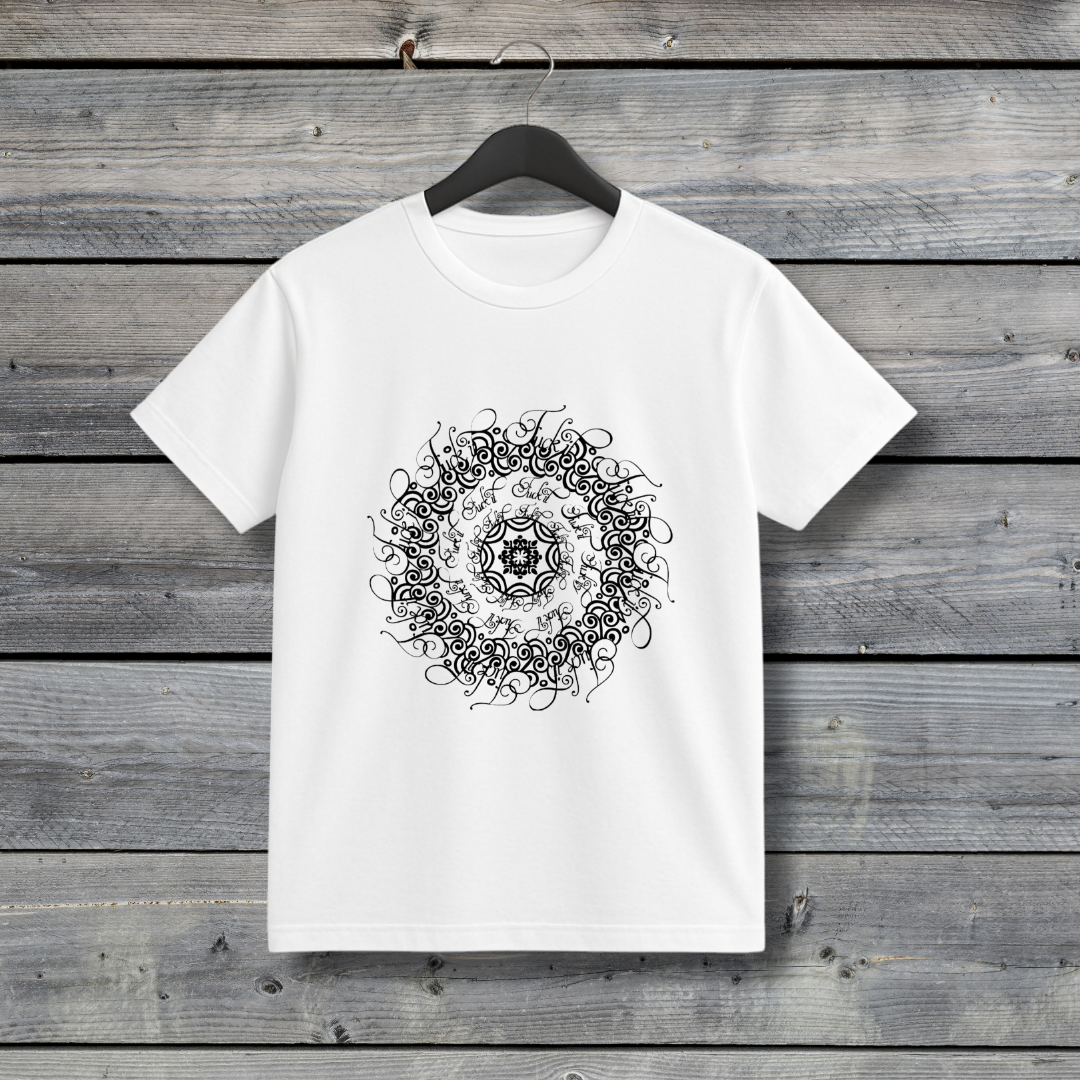 White t-shirt with black mandala design on a wooden background