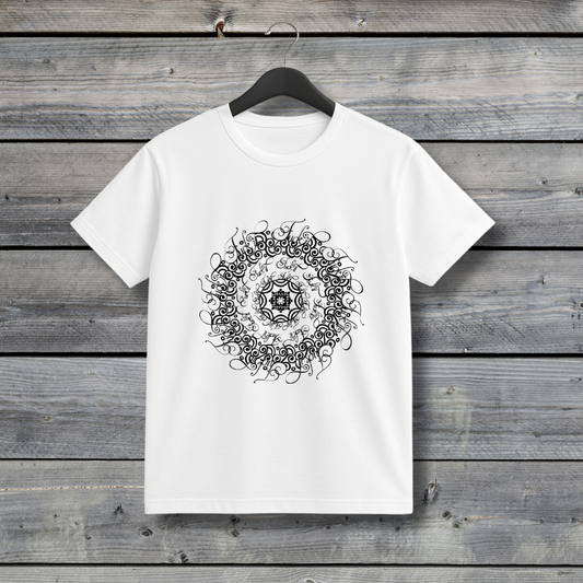 White t-shirt with black mandala design on a wooden background