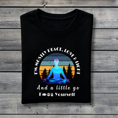 Black t-shirt with a graphic of a person meditating and text on a wooden background