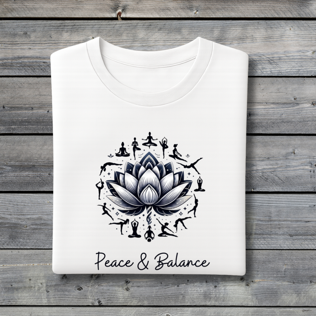 White t-shirt with black lotus flower design and 'Peace & Balance' text on a wooden background