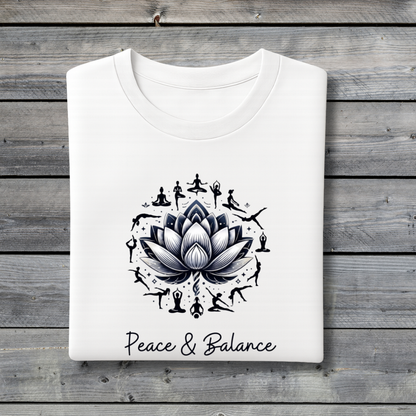 White t-shirt with black lotus flower design and 'Peace & Balance' text on a wooden background