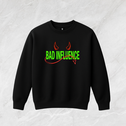 Black sweatshirt with 'Bad Influence' text and devil horns design on a textured white background