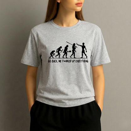 Person wearing a gray t-shirt with a graphic design and text on a plain background