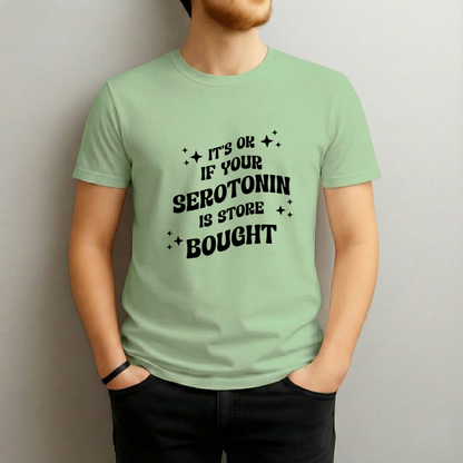 Person wearing a light green t-shirt with black text against a plain background