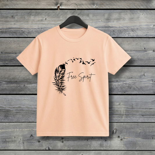 Peach t-shirt with 'Free Spirit' design on a wooden background